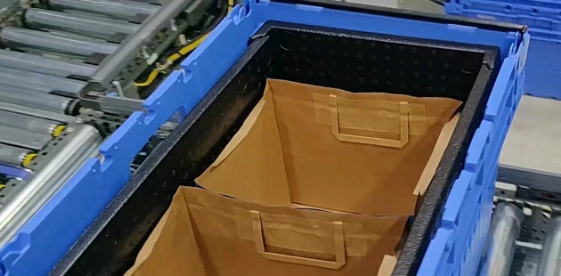 Header erecting inlays and placing paper bags2